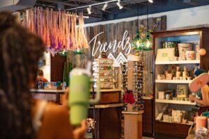A shopper looking at a mug at Trendz at the Park